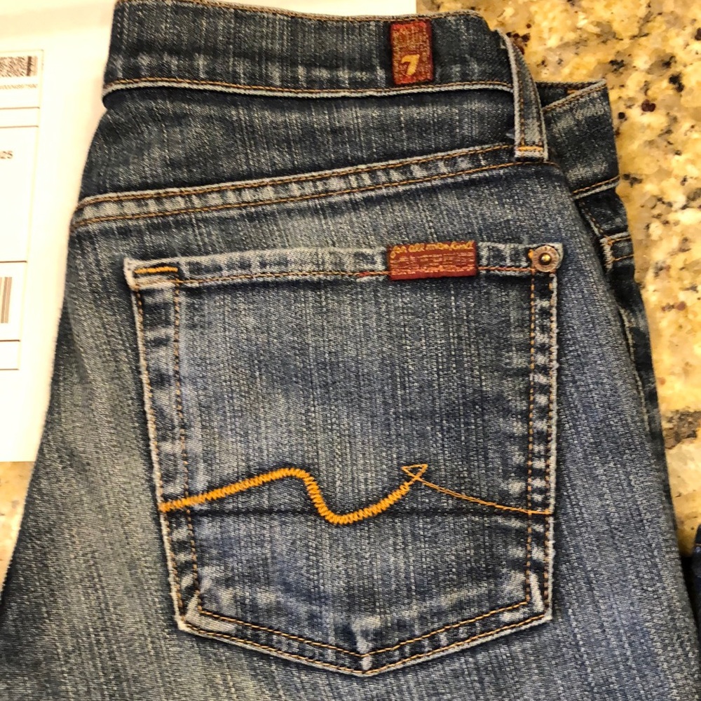 Seven for all mankind size 27 worn out bottom on one side measurements soon